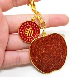 Amuleto con Manzana Roja Cósmica contra los conflictos